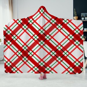 May include: Red and green plaid hooded blanket with a white background.