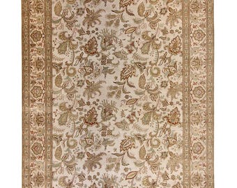 May include: A rectangular beige rug with an intricate floral pattern. The rug features a central field of cream color with detailed botanical designs in shades of brown, green, and red. A wide border frames the central design.