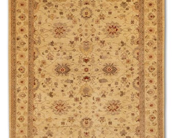 May include: A rectangular beige rug with an intricate floral pattern. The rug features a central field of beige with repeating floral motifs in shades of red, brown, and gray. A detailed border frames the design.