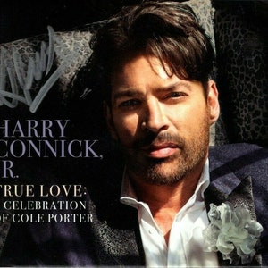 May include: A black and white photograph of Harry Connick Jr. on a CD cover. The text reads "HARRY CONNICK JR. TRUE LOVE: A CELEBRATION OF COLE PORTER".