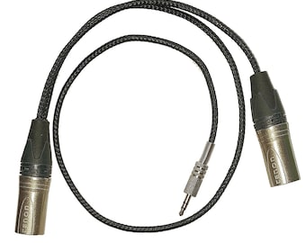 May include: A black cable with two gold-colored XLR connectors and one gold-colored 1/4 inch connector.