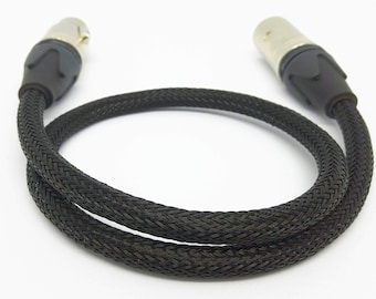 May include: Black braided cable with two silver XLR connectors.