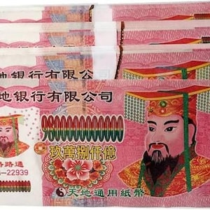 May include: A stack of pink rectangular paper notes featuring an illustration of a bearded figure in traditional headwear. The text includes Chinese characters, the number 980000000000, and the code DG-22939. The design incorporates floral motifs and a yin-yang symbol.