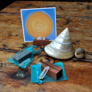 Wood stand and crystal shown with an Intention Portal card.