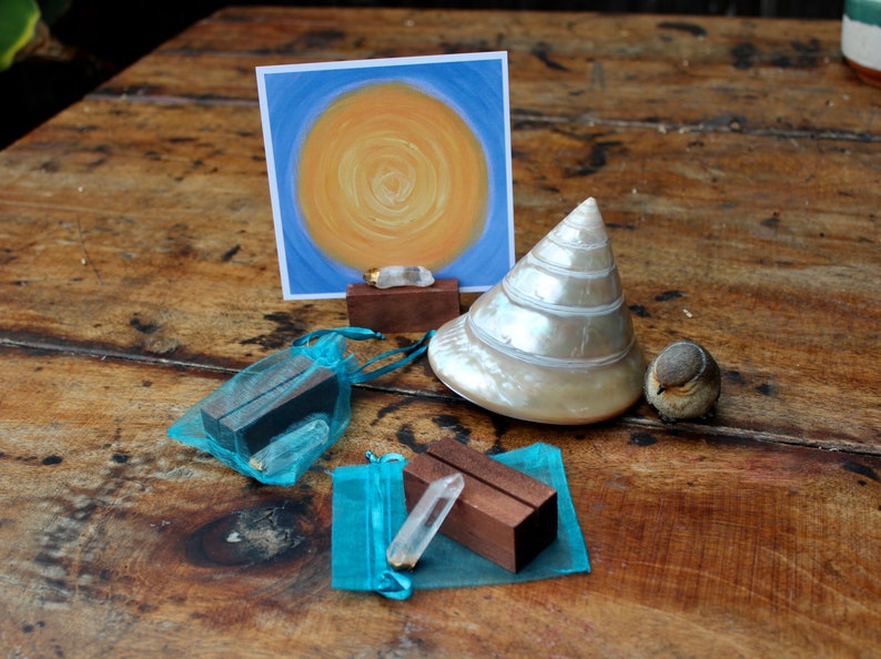 Wood stand and crystal shown with an Intention Portal card.