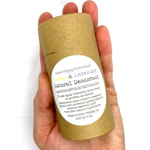 May include: A cylindrical, natural deodorant stick in a brown paper tube. The label reads "Lemon & Lavender Natural Deodorant" with the brand name "Sweet Poppy Homestead." The product contains 3 oz of deodorant.