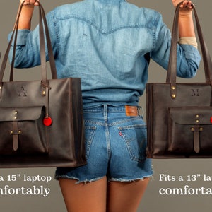 May include: Two brown leather tote bags, one large and one small, with long handles. The large bag has the letter "A" and the small bag has the letter "M" embossed on them. Each bag has a front pocket and a red tag. The large bag fits a 15" laptop comfortably, and the small bag fits a 13" laptop comfortably.