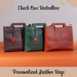 May include: Three personalized leather bags in brown, green, and orange. The bags have a simple design with a single handle and a small round leather tag. The text "Check Our Bestsellers" is at the top of the image and "Personalized Leather Bags" is at the bottom.