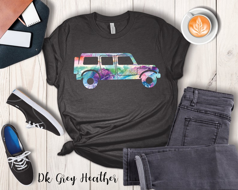 May include: Dark grey heather t-shirt with a colorful silhouette of a jeep. The jeep is outlined with a tropical leaf pattern.