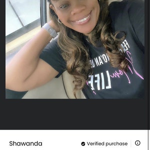 May include: A customer review with five stars for a black t-shirt with the text "My Life Is Not An Option" in pink lettering. The reviewer is wearing a black baseball cap with the text "Fear Is Not An Option" in pink lettering.