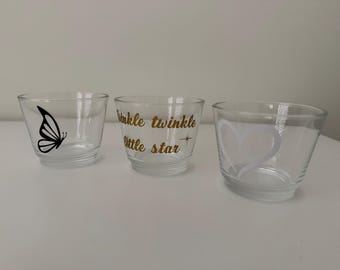 Luz recordatoria: portavelas con forma de mariposa, corazón o el texto "Estrellita".