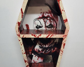Estante de exhibición de ataúdes con temática de payaso