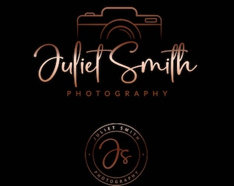 May include: A logo for a photography business called "Juliet Smith Photography". The logo features a stylized camera with a rose gold outline and the text "Juliet Smith Photography" in a script font. The logo also includes a smaller circle with the initials "JS" and the text "Juliet Smith Photography" in a smaller font.