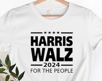 May include: White t-shirt with black text that reads "HARRIS WALZ 2024 FOR THE PEOPLE".