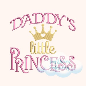 May include: Pink embroidered text on a light beige background reads "Daddy's little Princess" with a gold crown. The text is in a script font, and the crown has a heart in the center. The words "Tiny Dreams Embroidery" are also visible.