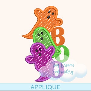 May include: Applique design featuring three ghosts in orange, green, and purple with white polka dots. The ghosts are stacked on top of each other and the text "BOO" is visible in the background.