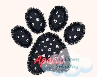 May include: Black and white paw print applique with a fringed edge. The paw print has a black background with white paw prints and the name "Apollo" embroidered in red.
