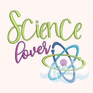 May include: An embroidered design with the words "Science Lover" in green and purple script. Below the text is an atom model in blue and green, resting on a cloud. The design includes the text "Tiny Dreams Embroidery".