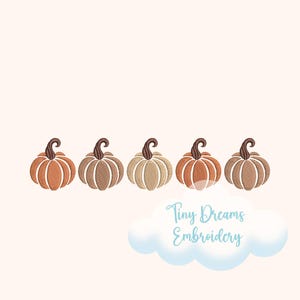 May include: Five embroidered pumpkins in shades of orange, brown, and beige are arranged in a row. Each pumpkin has a brown stem and is stitched with detailed lines. The text "Tiny Dreams Embroidery" is below the pumpkins.