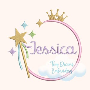 May include: An embroidered design featuring the name "Jessica" in lavender script within a pink circle, adorned with a gold crown, stars, and a wand with ribbons. The text "Tiny Dreams Embroidery" is also included.