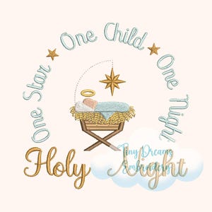 May include: A blue and gold embroidery design featuring a baby Jesus in a manger with a star above. The text around the design reads "One Star One Child One Night Holy Night".