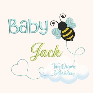 May include: Embroidered design featuring the words "Baby Jack" with a cute cartoon bee flying above the name. The bee has black and yellow stripes and blue wings. A blue dotted line trails behind the bee, forming a heart shape and a cloud with the text "Tiny Dreams Embroidery".