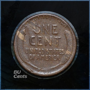 May include: A close-up of a copper-colored United States one-cent coin. The coin features the words "ONE CENT" and "UNITED STATES OF AMERICA". The coin is set against a dark background with the text "BU Cents" in the lower left corner.