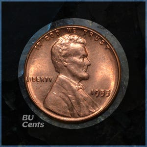 May include: A copper-colored 1955 Lincoln cent coin. The obverse features a profile of Abraham Lincoln, the word "LIBERTY", and the motto "IN GOD WE TRUST". The year "1955" is visible. The coin is set against a dark background.