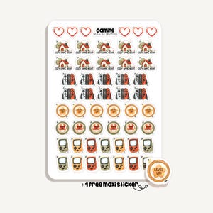 Puede incluir: Una hoja de pegatinas con varios diseños temáticos de juegos. Incluye corazones, casas, mandos de consola y consolas portátiles retro. El texto "Gaming" y "Cozy Game Night" es visible. También se incluye una pegatina extra con "Level Up!"