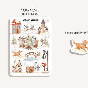 May include: A sticker sheet titled Winter Village by Iruzoo measuring 14.8 x 10.5 cm (5.8 x 4.1 in.) featuring watercolor illustrations of houses, a Christmas tree, a snowman, a bridge, a lamp post, and a dog, plus a free maxi dog sticker.