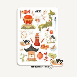 Könnte beinhalten: Ein Stickerbogen mit japanischen Illustrationen. Dargestellt sind ein rotes Torii-Tor, eine Karte von Japan, ein Kimono, eine Glückskatze, ein Kranich und ein Teeservice. Der Text "Japan by IBUZOO" ist sichtbar. Enthält einen Bonus-Aufkleber.