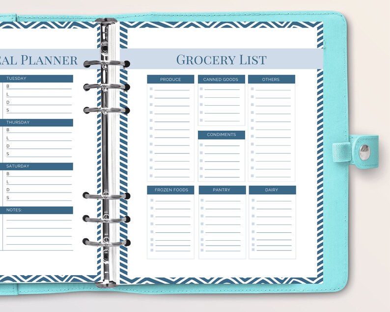 May include: A blue and white planner with a grocery list on the right page. The grocery list is divided into categories: produce, canned goods, others, condiments, frozen foods, pantry, and dairy. Each category has a list of blank lines for writing.