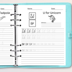 May include: A black and white workbook with lined pages for practicing writing the letter U. The page includes a picture of a unicorn and the words "U for Unicorn".