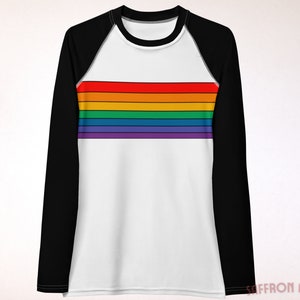 May include: A white long-sleeve shirt with black raglan sleeves and a rainbow stripe design across the chest.