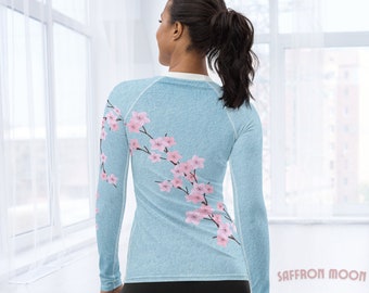 Sky-Blue Cherry Blossom Rash Guard, Pink Sakura Floral Print, Breathable UV Protection Sport Shirt, SUP Surf Swim Gym Jiu-Jitsu Athleisure