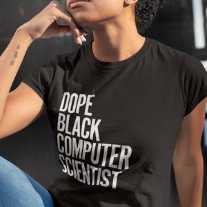 May include: A black t-shirt with white text that reads "Dope Black Computer Scientist".