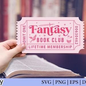 May include: A pink ticket with the words "Fantasy Book Club Lifetime Membership" in a decorative font. The ticket has a serrated edge and is held over an open book. The background is a blurred image of bookshelves.