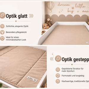 May include: A beige baby changing pad with a quilted design, set within a white changing table. The pad has a smooth, elegant look and is easy to care for. The text "Optik glatt" and "Optik gesteppt" are visible.