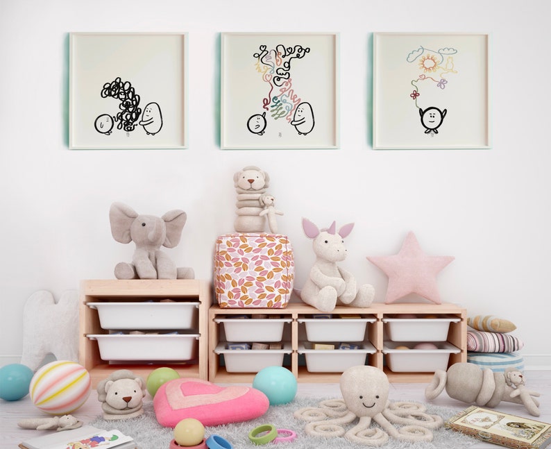 May include: A children's playroom with a white wall, three framed black and white drawings, a wooden shelf with white drawers, and various stuffed animals including an elephant, a unicorn, an octopus, and a lion. The shelf is filled with colourful balls and toys.