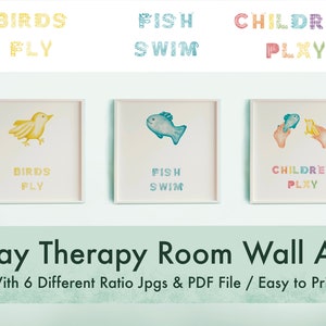 May include: Three printable wall art prints for a play therapy room. Each print features a colorful illustration and text. The first print shows a yellow bird with the text "Birds Fly". The second print shows a blue fish with the text "Fish Swim". The third print shows two hands holding a blue fish and a yellow bird with the text "Children Play".