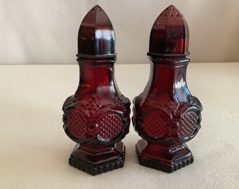 Vintage Avon Products, Inc. Ruby Red Cape Cod 1876 pattern salt and pepper shakers set.  Discontinued.  1975 to 1992