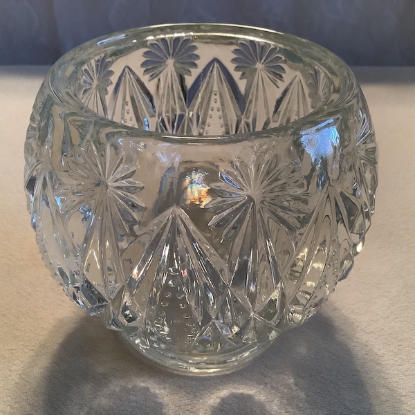 Vintage Avon Crystal Glow pattern clear glass votive or tea light candle holder with a starburst and diamond design. Avon embossed on bottom