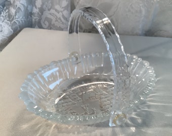 Vintage Mikasa Winter Dreams pattern Christmas Holiday clear and frosted glass oval candy or nut basket with plastic handle.  Discontinued