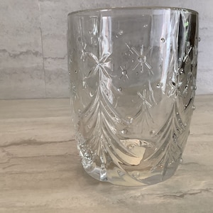 May include: A clear glass tumbler with a starburst pattern etched into the glass.