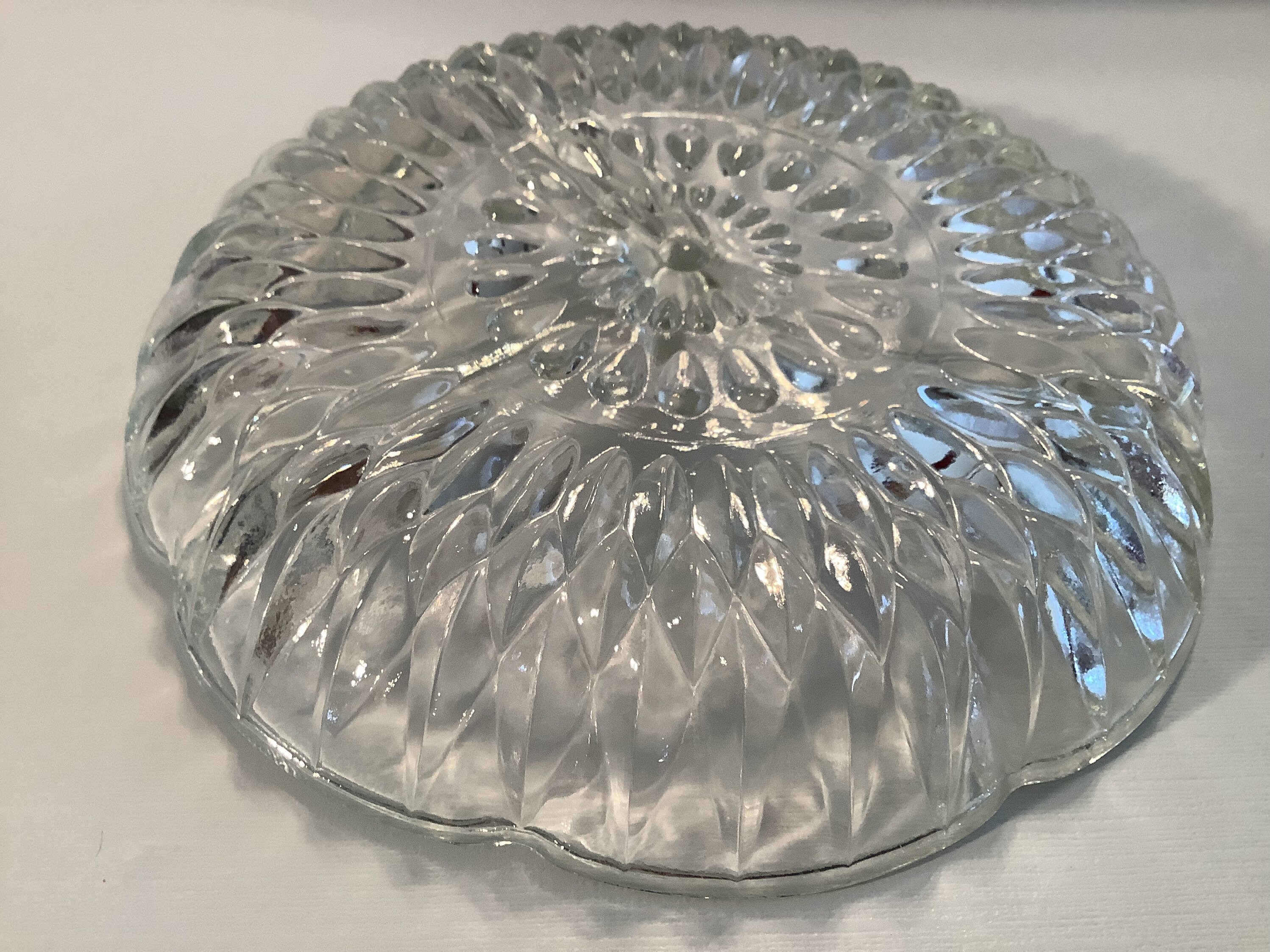 Vintage clear glass divided relish tray in a flower shape with