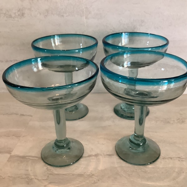 Used Mexico hand blown clear glass Margarita glass with an aqua glass rim.  Set of 4 glasses