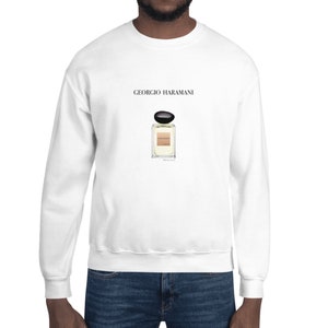 May include: White sweatshirt with the text "Giorgio Harmani" and a black and gold perfume bottle graphic.