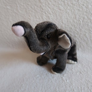 Plush elephant. Stuffed Trumpet. Rare beanie babies. Birthday February 11, 2000. Collectible Toy. Ty beanie babies. Silver label. Beanbag.