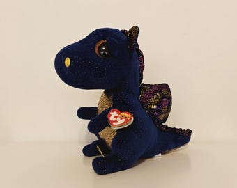 Ty Beanie Boos “Saffire” Drago Triste – Peluche Blu Glitterato, 23 cm, Ali Scintillanti, Occhi Espressivi, Peluche da Collezione Fuori Produzione