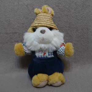 Vintage rare plush rabbit. In a blue velvet jumpsuit and a straw hat. White fluffy beard, green eyes and a heart-shaped nose. Height 23 cm.